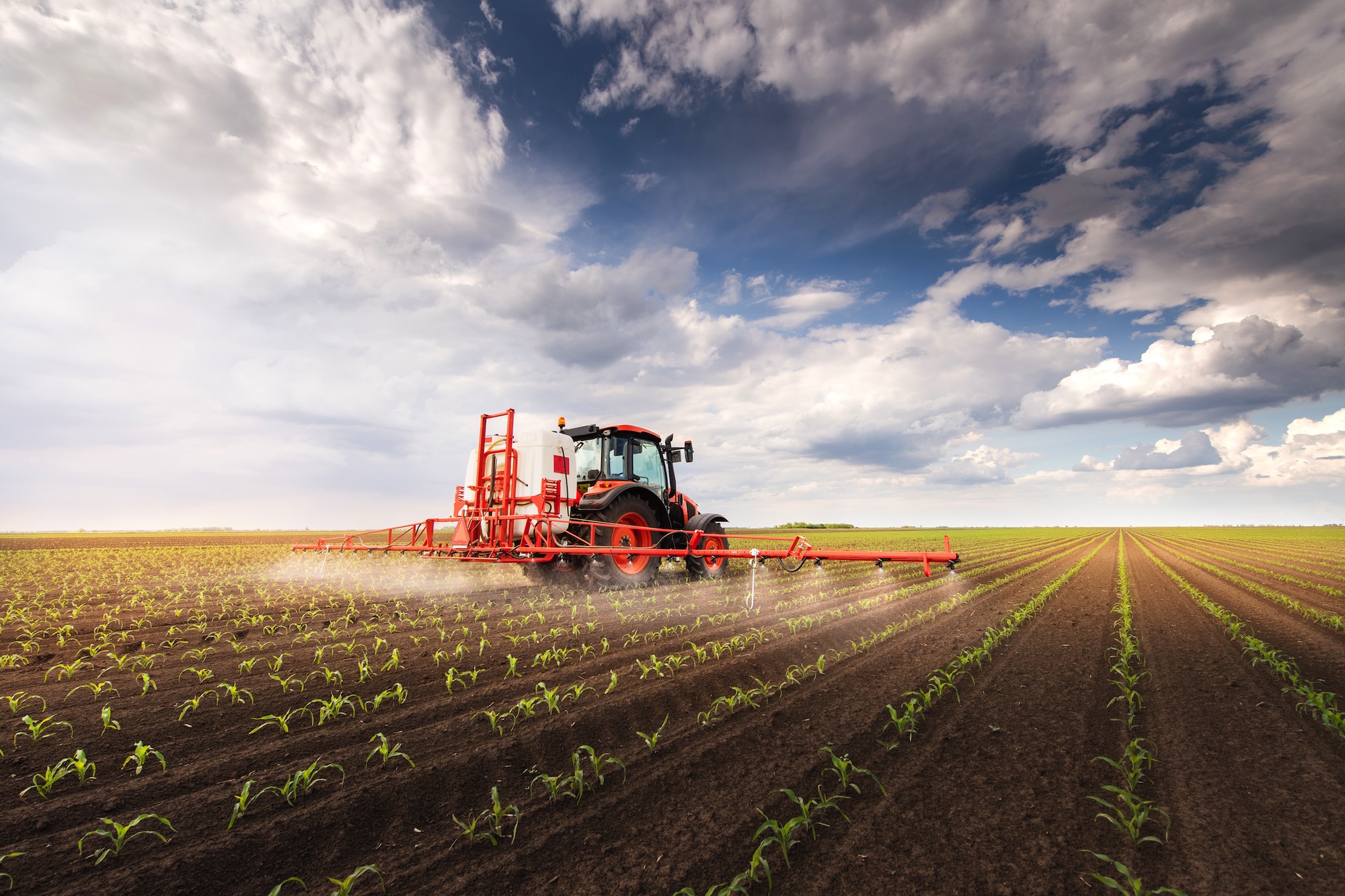 Crop spraying using agricultural equipment